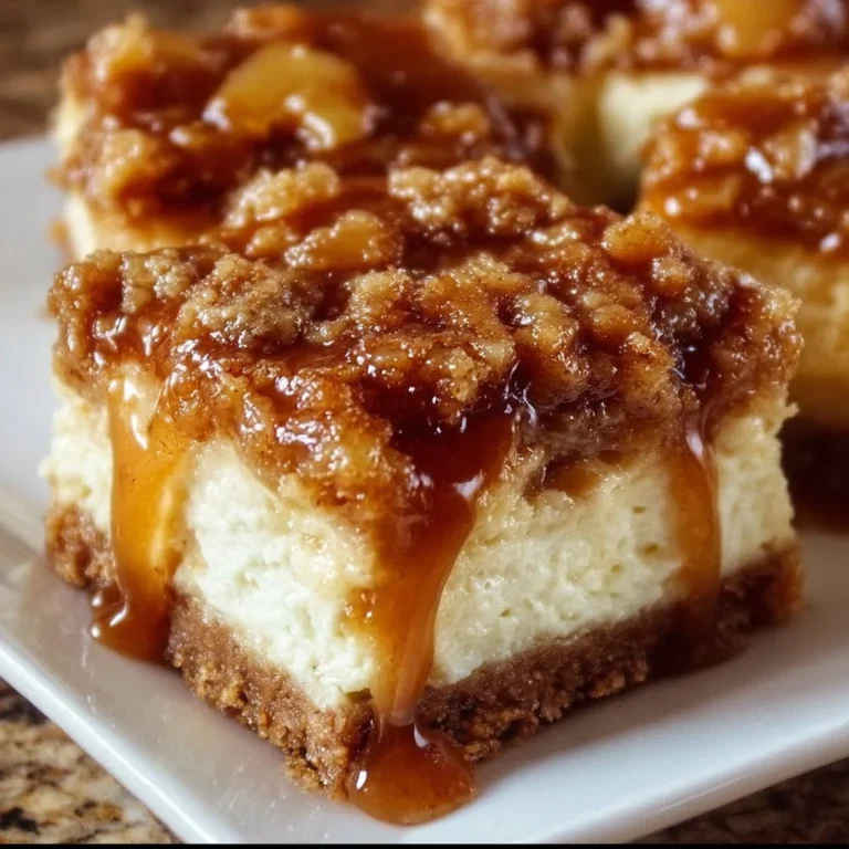 Delicious caramel apple cheesecake bars topped with caramel drizzle.