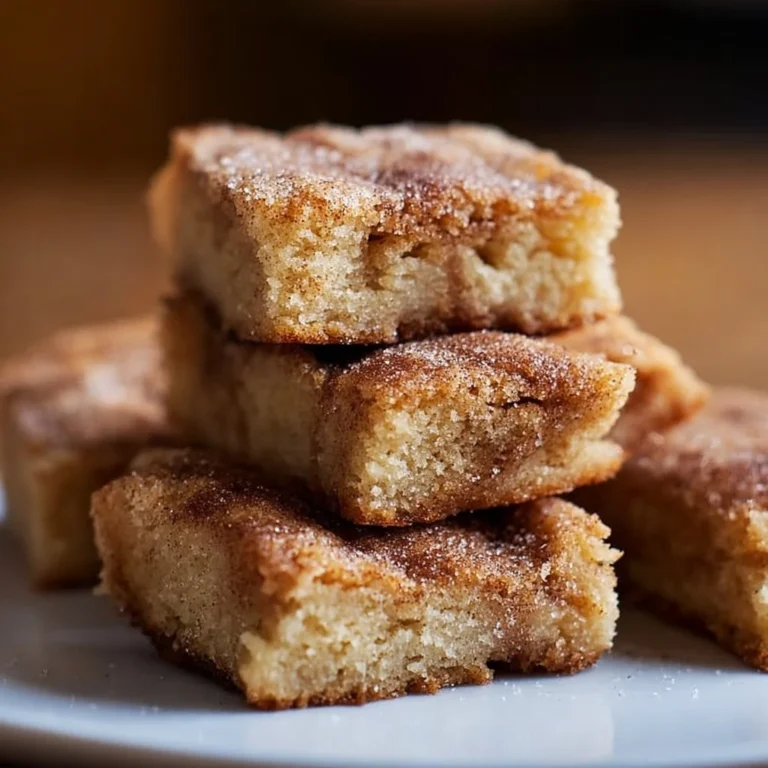 Deliciously baked Cinnamon Sugar Blondies topped with a warm cinnamon sugar swirl.