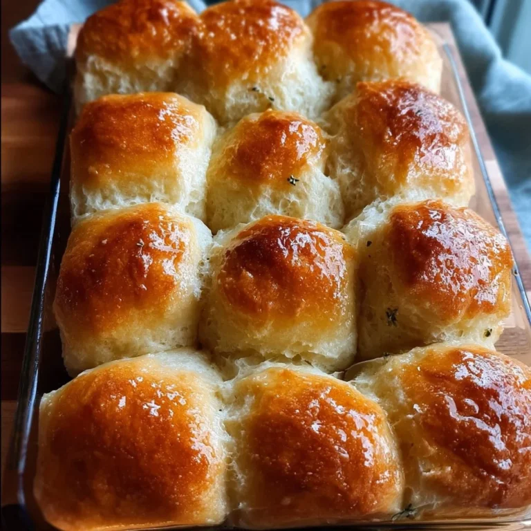 Freshly baked gluten-free dinner rolls on a wooden tray
