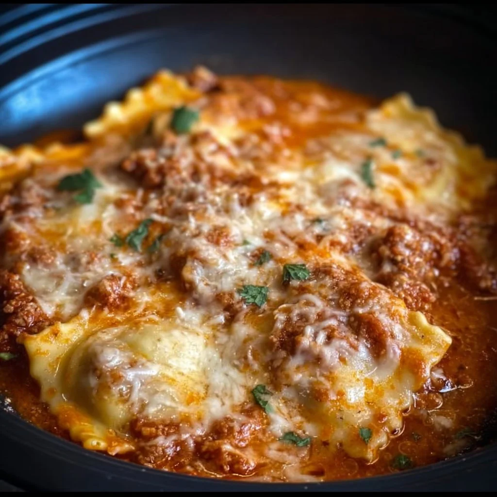Delicious crockpot ravioli lasagna dish served with cheese and herbs