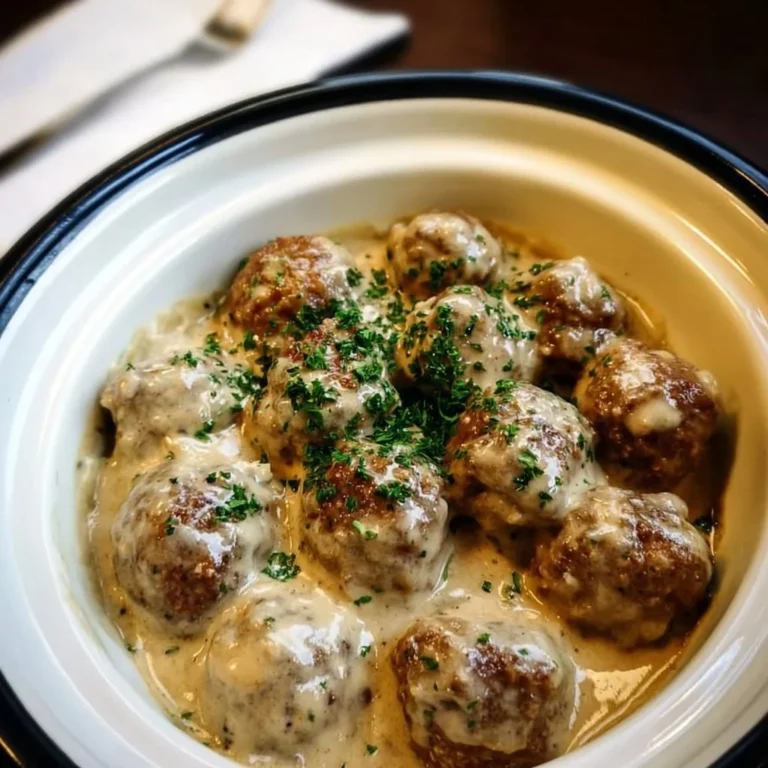 Crockpot Swedish Meatballs served with creamy gravy on a plate