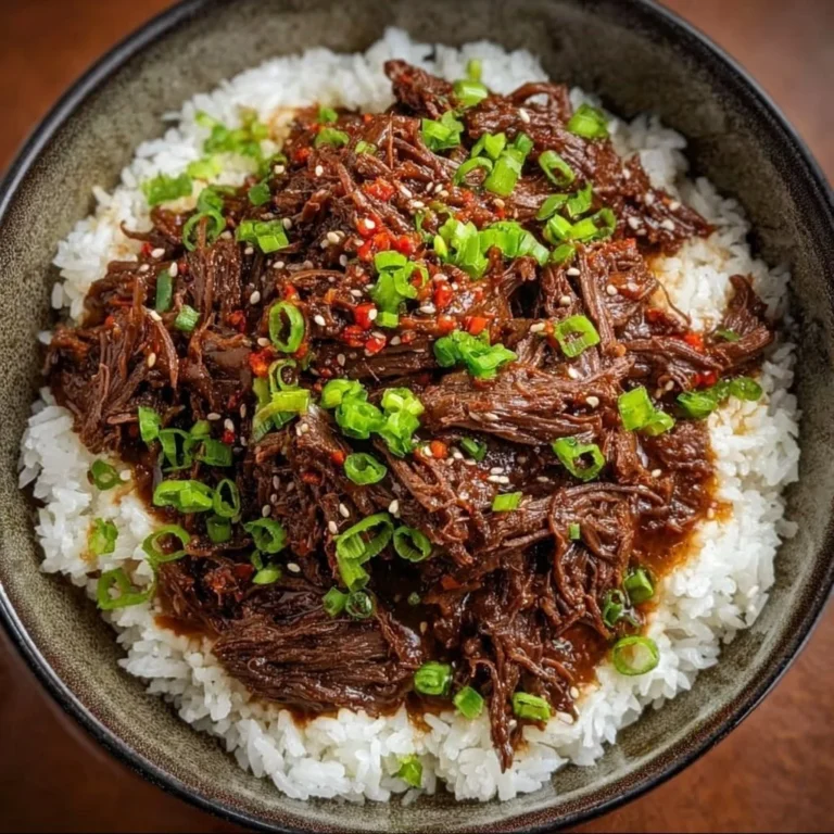 Delicious bowl of Slow Cooker Korean Beef with vegetables and sauce